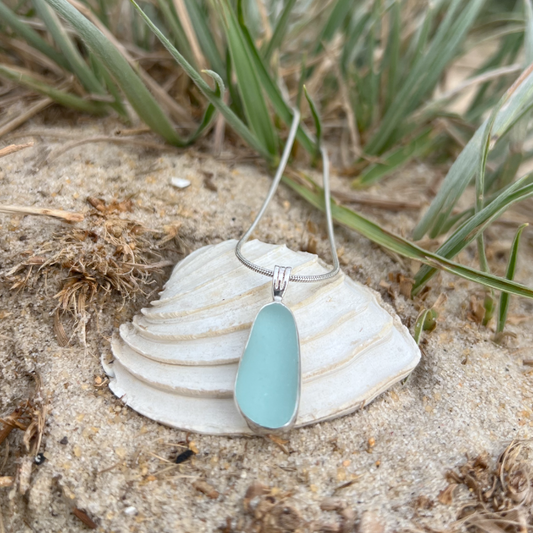 Soft blue sea glass set in silver pendant by Mornington Sea Glass. Hangs on a 40 or 45cm sterling silver snake chain.