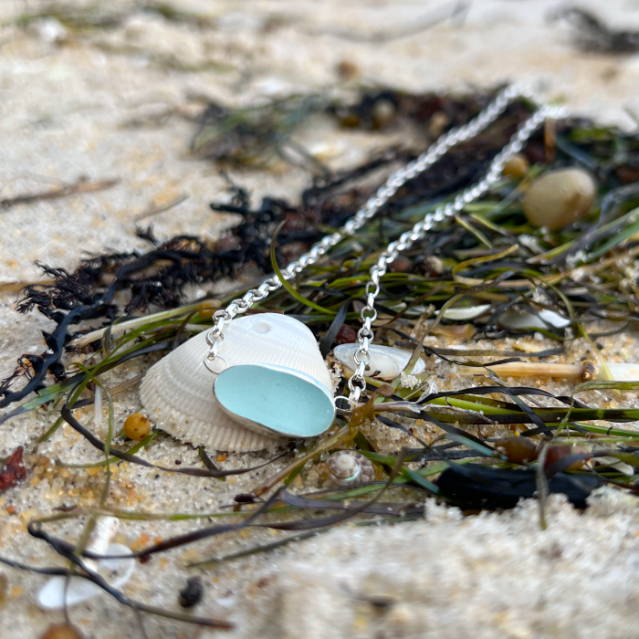 Soft blue sea glass set in silver pendant by Mornington Sea Glass. Hangs on a 40cm sterling silver belcher chain.