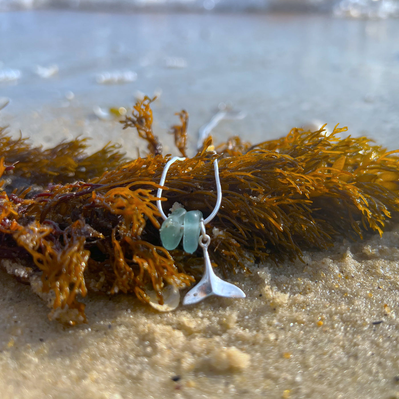 Ocean Teal sea glass and silver whale tail charm necklace by Mornington Sea Glass. Comes with a 40 or 45cm sterling silver snake chain.