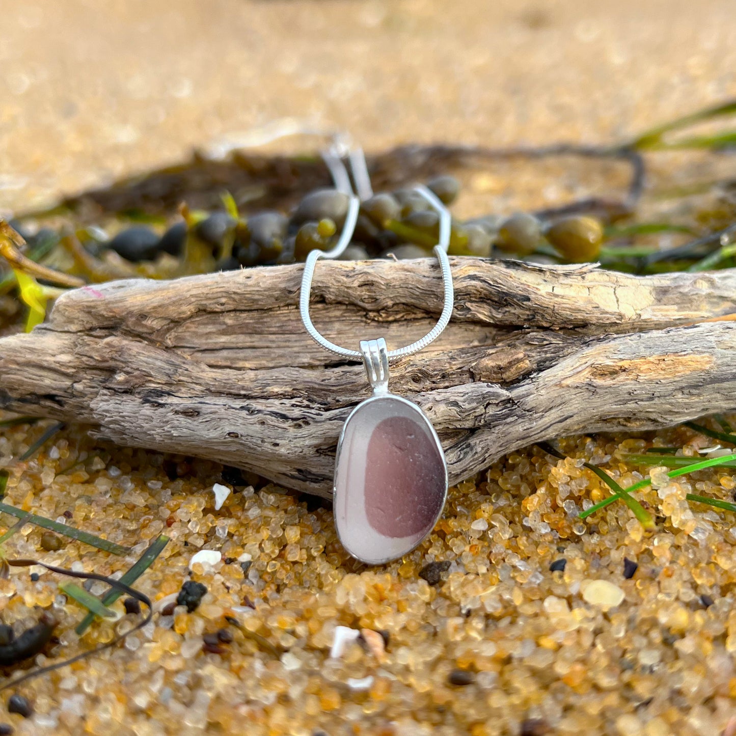 Rare burgundy pink and white multi colour sea glass from England set in silver. Comes with a 40 or 45cm sterling silver chain. Pendant necklace by Mornington Sea Glass