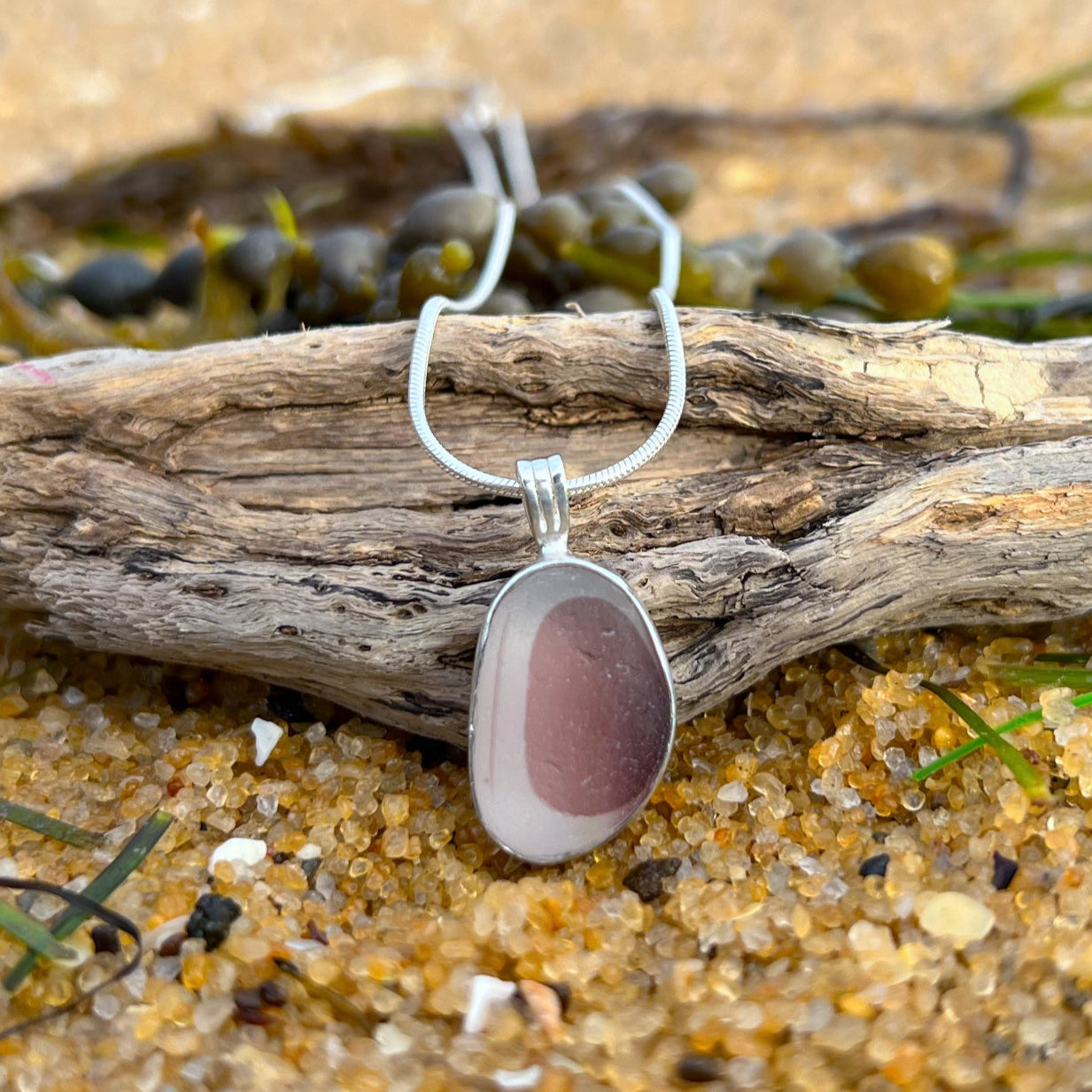 Rare burgundy pink and white multi colour sea glass from England set in silver. Comes with a 40 or 45cm sterling silver chain. Pendant necklace by Mornington Sea Glass