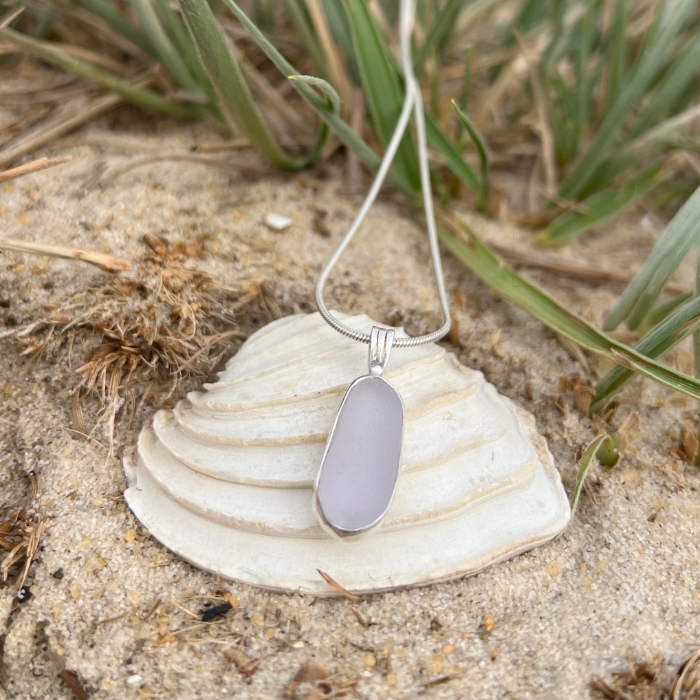Purple sea glass set in silver pendant by Mornington Sea Glass. Hangs on a 40 or 45cm sterling silver snake chain.