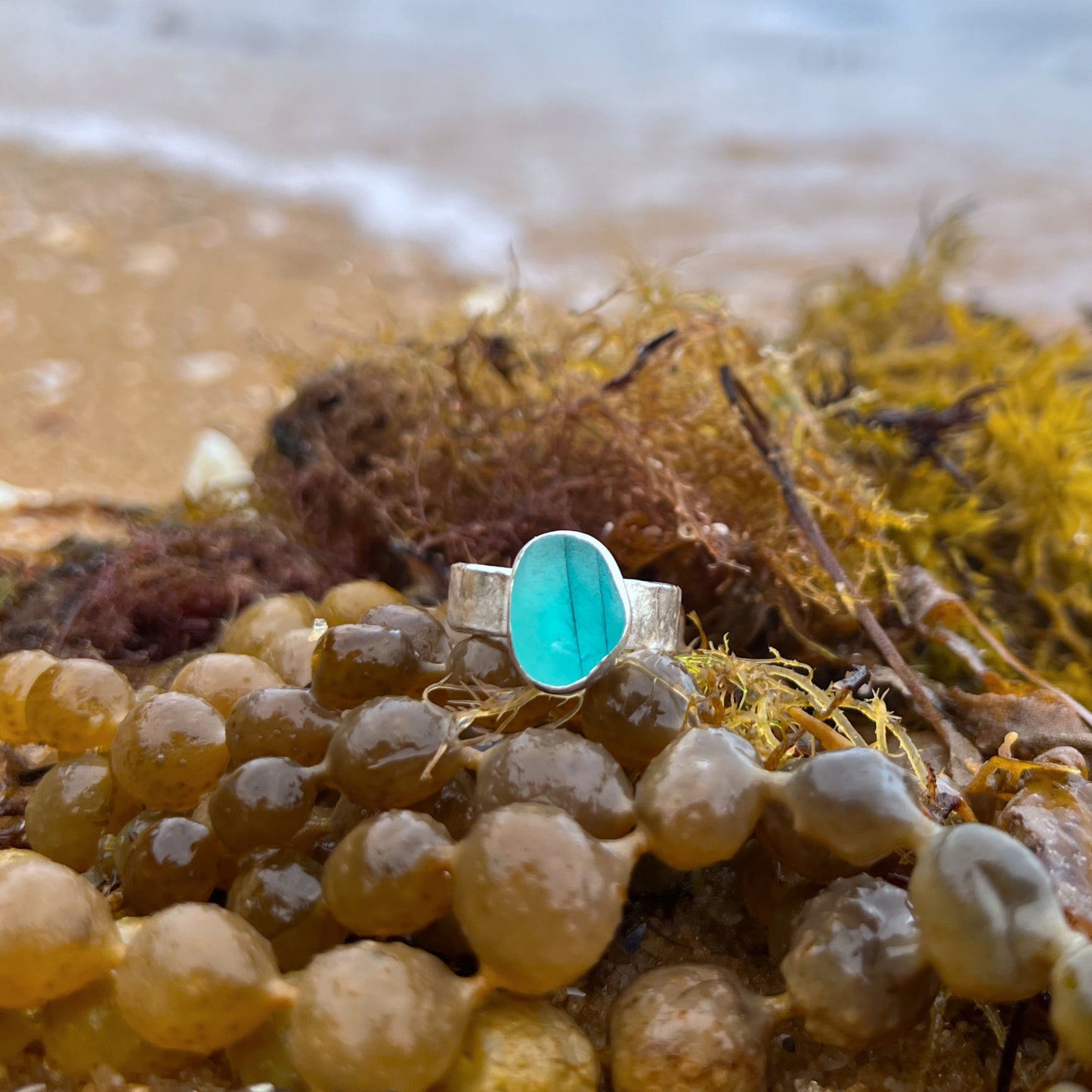 Multi colour sea glass from England set in silver on a cast driftwood inspired silver ring band by Mornington Sea Glass. Size 7 3/4