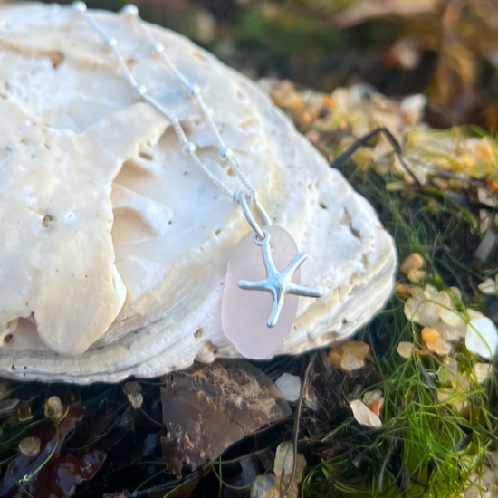 Purple sea glass and sterling silver starfish pendant by Mornington Sea Glass. Hangs on a 40cm + 5cm extension ball detail chain.