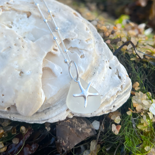 White sea glass and sterling silver starfish pendant by Mornington Sea Glass. Hangs on a 40cm + 5cm extension ball detail chain.