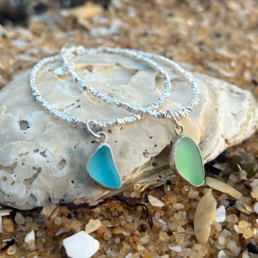 Sea glass set in silver surf bracelets by Mornington Sea Glass.