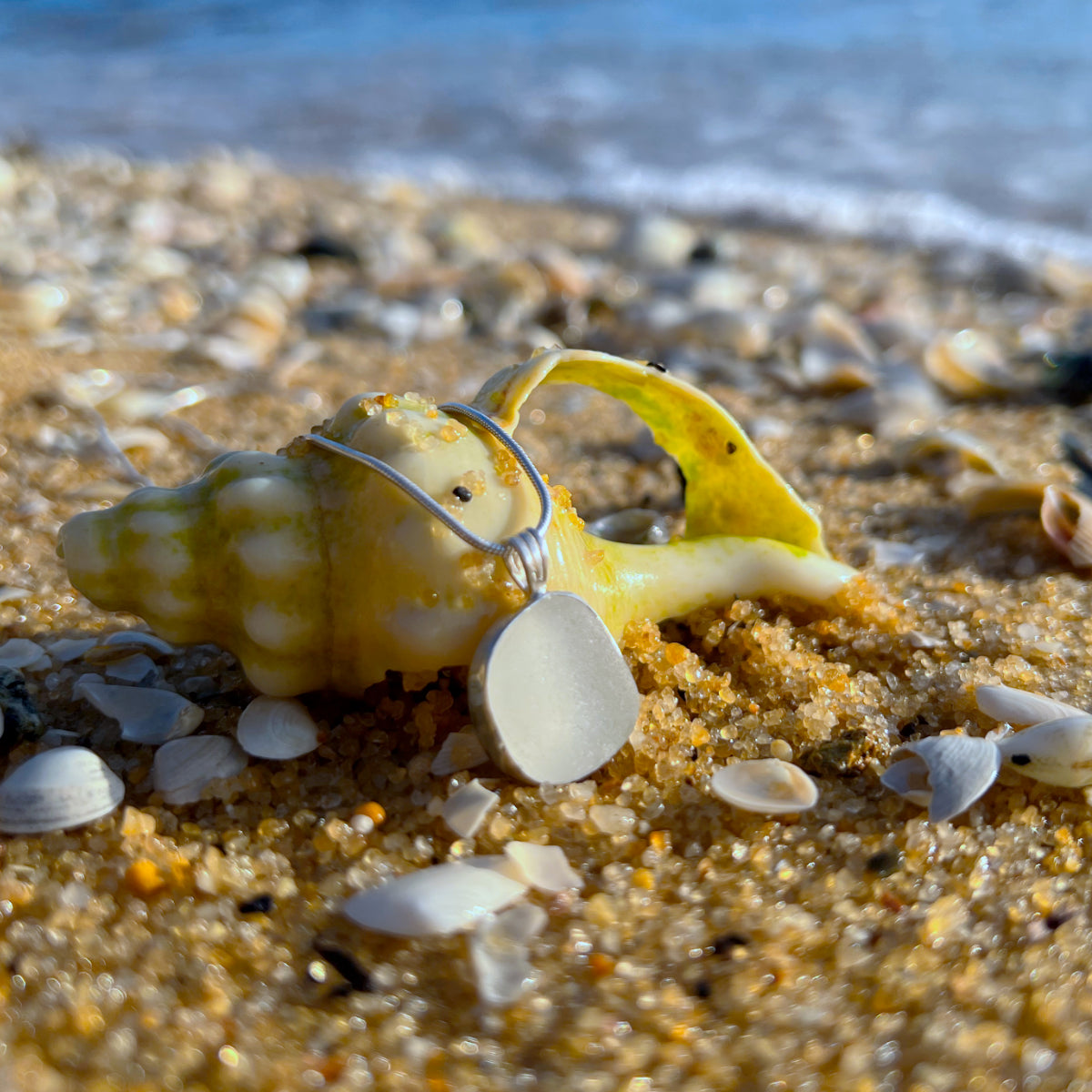 White Sea glass set in silver pendant by Mornington Sea Glass. Comes with a 40 or 45cm sterling silver chain.