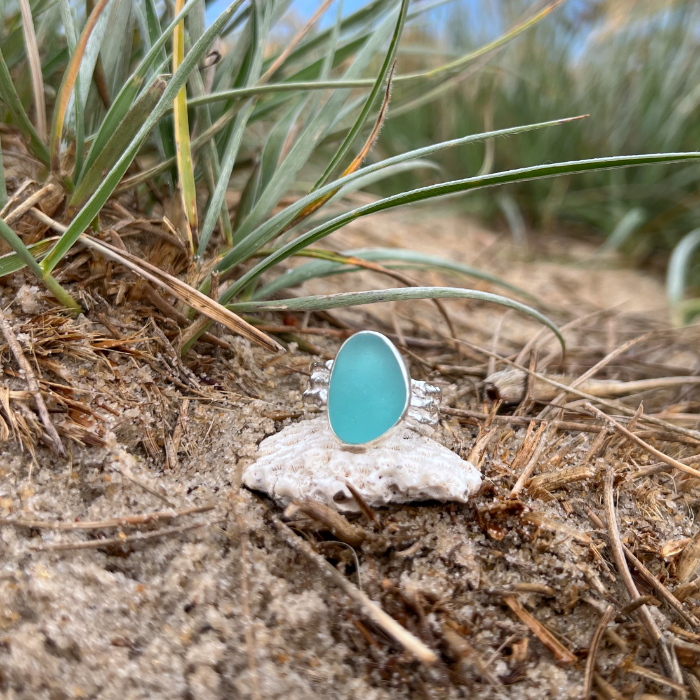 Aqua Blue sea glass set in silver on a cast driftwood inspired silver ring band by Mornington Sea Glass. Size 7 3/4