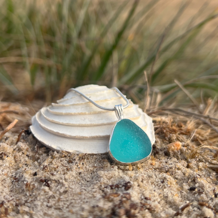 Aqua Teal sea glass set in silver pendant by Mornington Sea Glass. Hangs on a 40 or 45cm sterling silver snake chain.