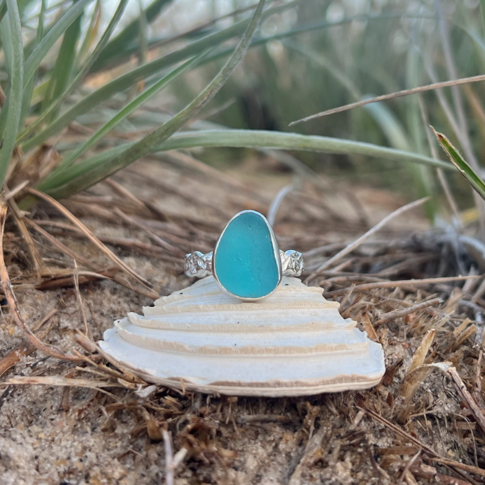 Aqua teal sea glass set in silver on organic rippled ring band by Mornington Sea Glass. Size 9 1/2.
