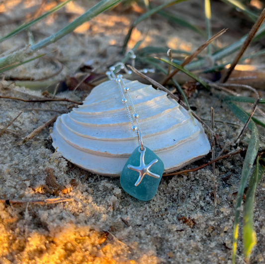 Aqua teal sea glass and sterling silver starfish pendant by Mornington Sea Glass. Hangs on a 40cm + 5cm extension ball detail chain.