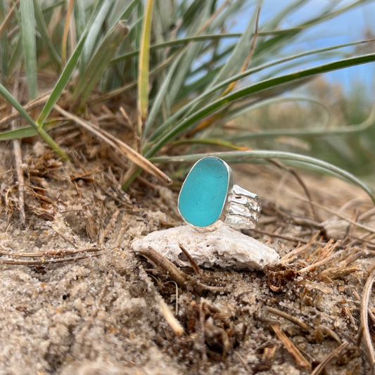 Aqua teal sea glass set in silver on a cast driftwood inspired silver ring band by Mornington Sea Glass. Size 6 3/4.