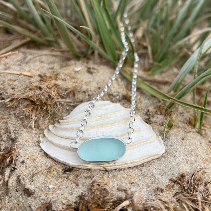 Soft blue sea glass set in silver pendant by Mornington Sea Glass. Hangs on a 40cm  sterling silver belcher chain. 