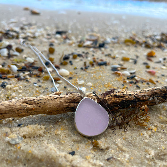 Purple sea glass set in Argentium silver. Hangs on a 40 or 45cm sterling silver chain. Pendant by  Mornington Sea Glass