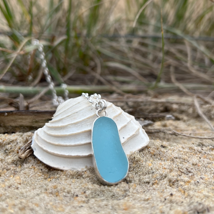 Blue sea glass set in Argentium silver pendant by Mornington Sea Glass. Hangs from a 40 or 45cm sterling silver belcher chain
