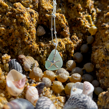 Soft seafoam blue sea glass and sterling silver starfish pendant by Mornington Sea Glass. Hangs on a 40cm + 5cm extension ball detail chain.