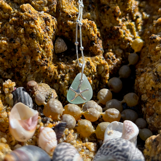 Soft seafoam blue sea glass and sterling silver starfish pendant by Mornington Sea Glass. Hangs on a 40cm + 5cm extension ball detail chain.