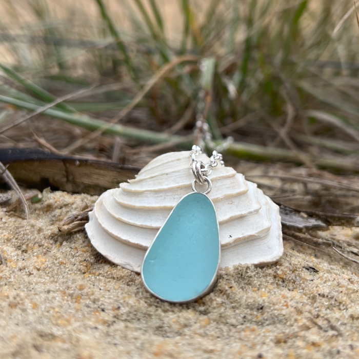 Blue sea glass set in silver pendant by Mornington Sea Glass. Hangs on a 40 or 45cm sterling silver belcher  chain.