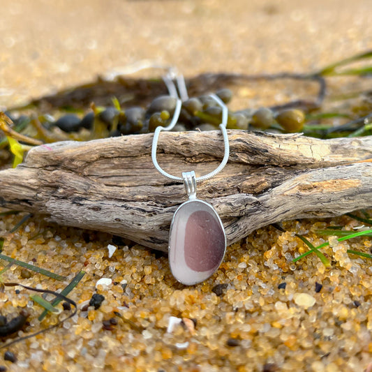 Rare burgundy pink and white multi colour sea glass from England set in silver. Comes with a 40 or 45cm sterling silver chain. Pendant necklace by Mornington Sea Glass