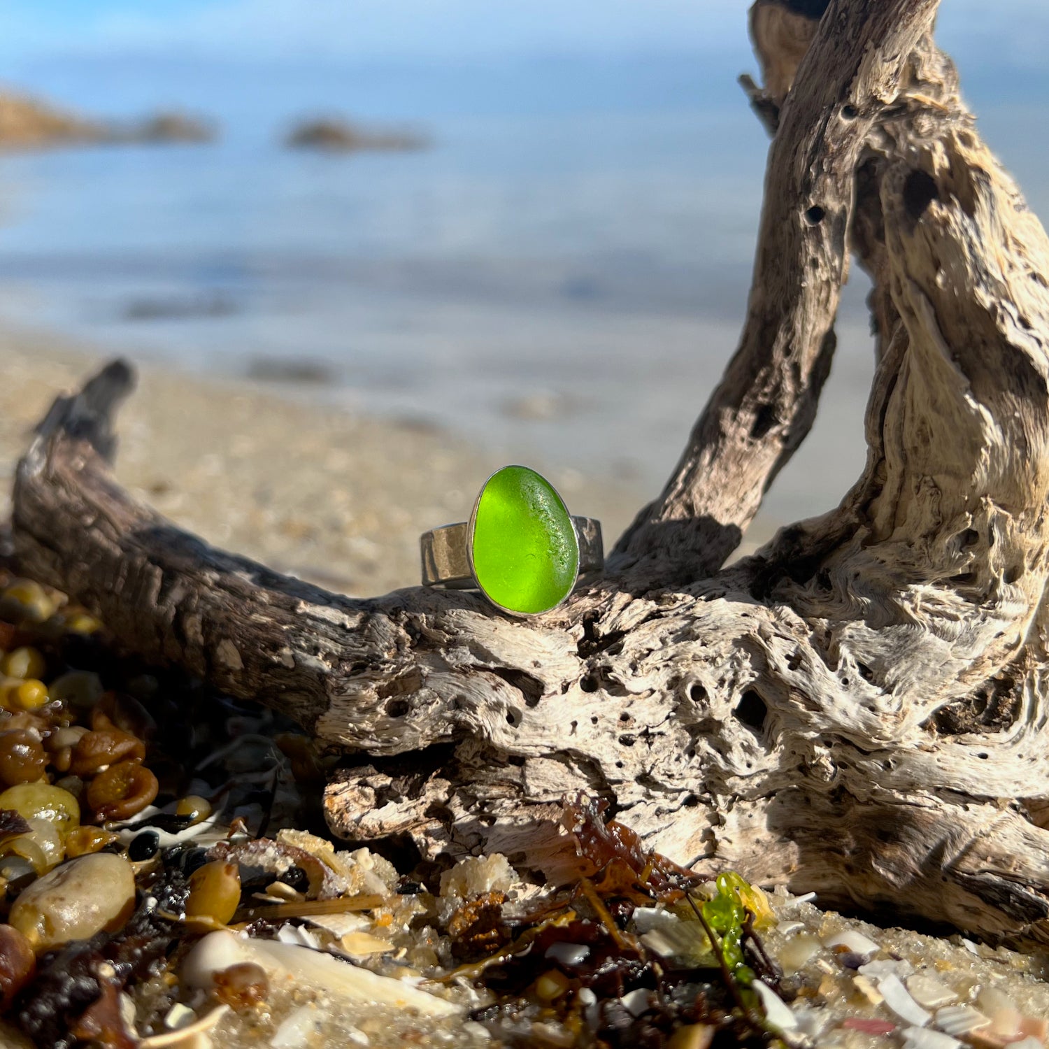 Green sea glass set in Argentium silver with hammered sterling silver textured ring band by Mornington Sea Glass. Size 9