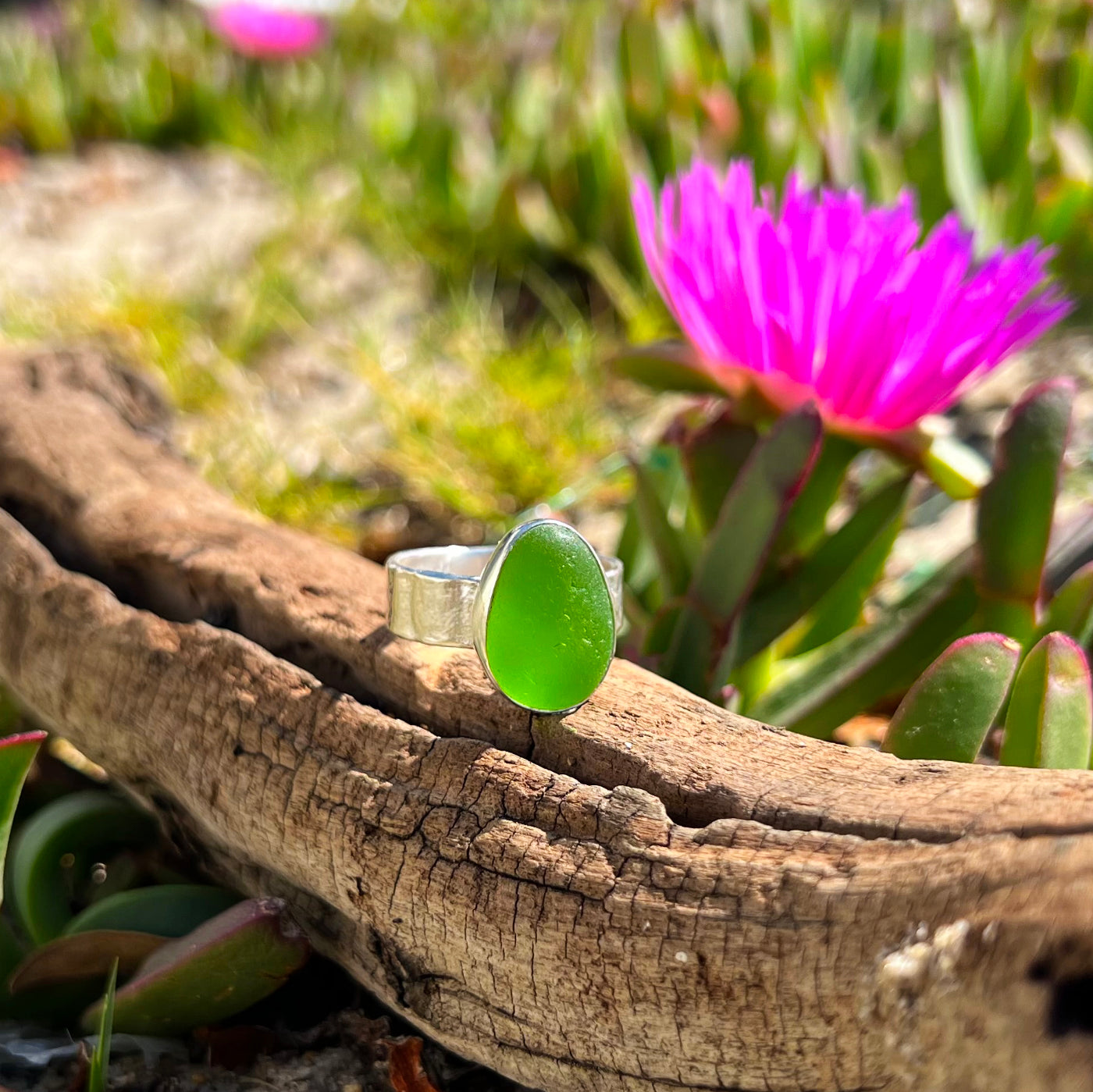 Green sea glass set in Argentium silver with hammered sterling silver textured ring band by Mornington Sea Glass. Size 9.
