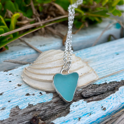 Ocean Teal  naturally shaped sea glass heart set in silver pendant by Mornington Sea Glass. Comes with a 40 or 45cm sterling silver  chain.