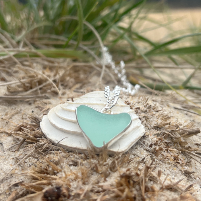 Seafoam green naturally shaped sea glass heart set in silver pendant by Mornington Sea Glass. Comes with a 40 or 45cm sterling silver  chain.