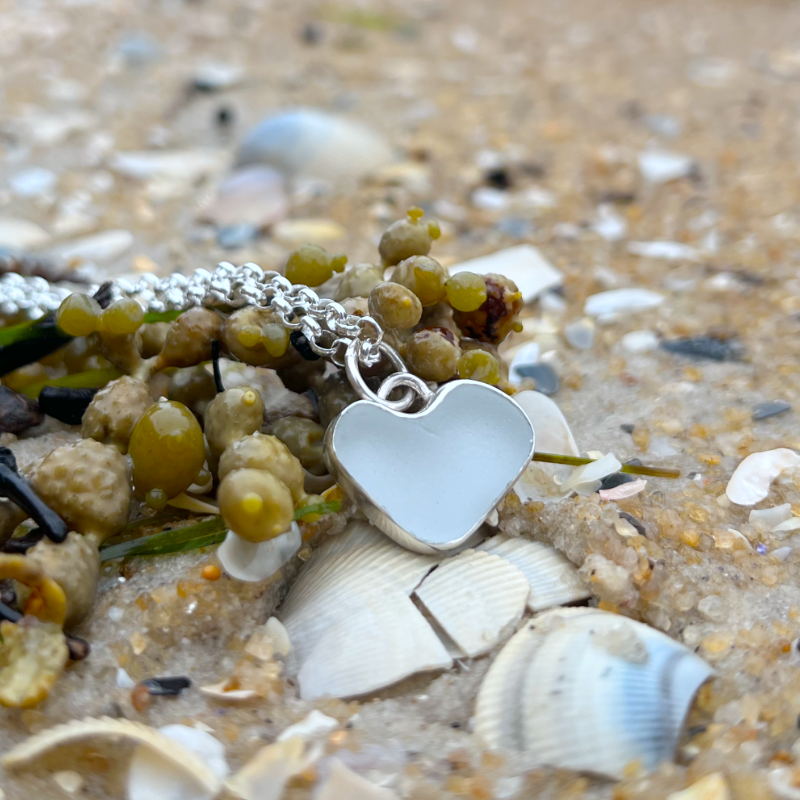 White  naturally shaped sea glass heart set in silver pendant by Mornington Sea Glass. Comes with a 40 or 45cm sterling silver  chain.