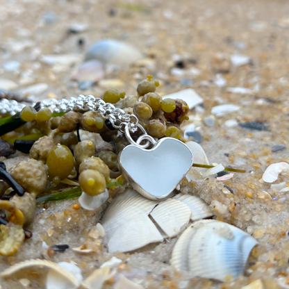 White  naturally shaped sea glass heart set in silver pendant by Mornington Sea Glass. Comes with a 40 or 45cm sterling silver  chain.