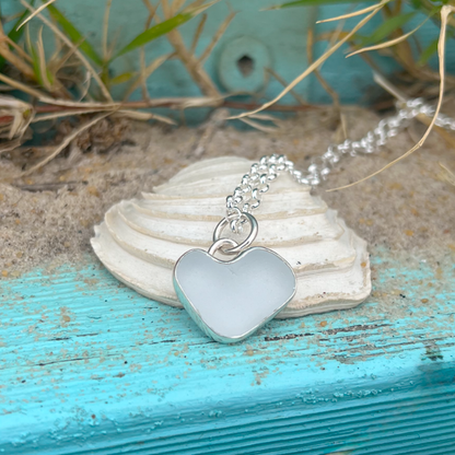 White  naturally shaped sea glass heart set in silver pendant by Mornington Sea Glass. Comes with a 40 or 45cm sterling silver  chain.
