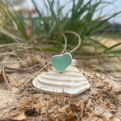 Seafoam green sea glass set in silver on a rippled ring band by Mornington Sea Glass. Size 9 1/4.