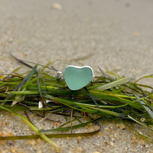 Seafoam green sea glass set in silver on a rippled ring band by Mornington Sea Glass. Size 9 1/4.