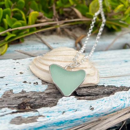Seafoam green naturally shaped sea glass heart set in silver pendant by Mornington Sea Glass. Comes with a 40 or 45cm sterling silver  chain.