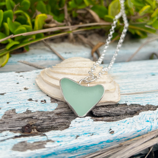 Seafoam green naturally shaped sea glass heart set in silver pendant by Mornington Sea Glass. Comes with a 40 or 45cm sterling silver  chain.