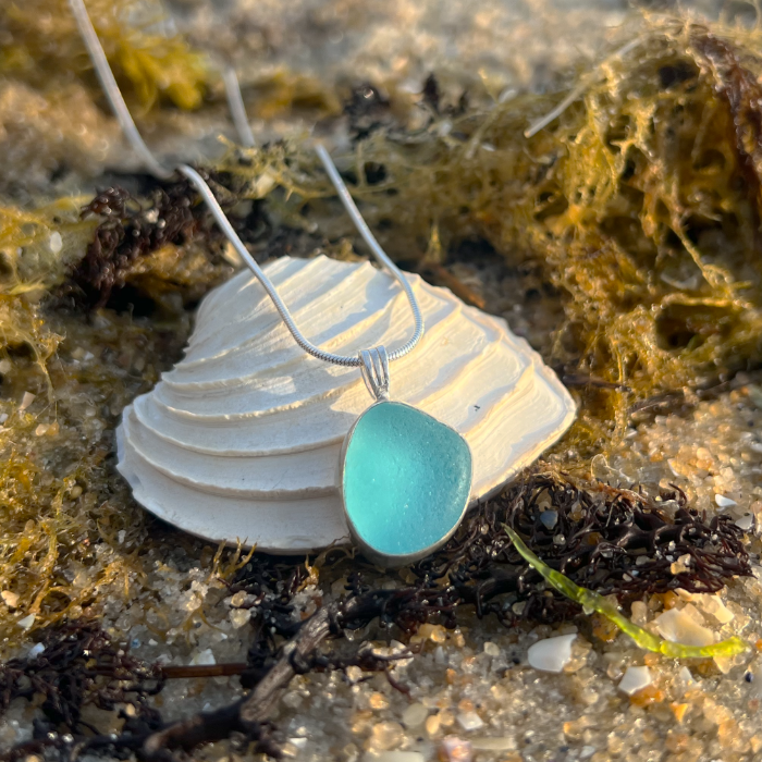 Blue sea glass set in silver pendant by Mornington Sea Glass. Hangs on a 40 or 45cm sterling silver snake chain.