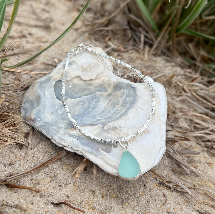 Seafoam sea glass set in silver surf bracelet by Mornington Sea Glass.