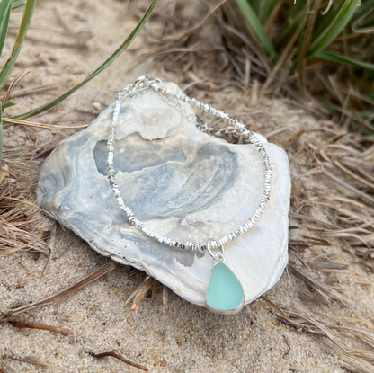 Seafoam sea glass set in silver surf bracelet by Mornington Sea Glass.