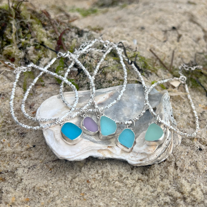 Sea glass set in silver surf bracelets by Mornington Sea Glass.