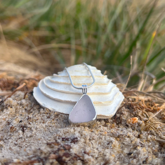 Purple sea glass set in silver pendant by Mornington Sea Glass. Hangs on a 40 or 45cm sterling silver snake chain.