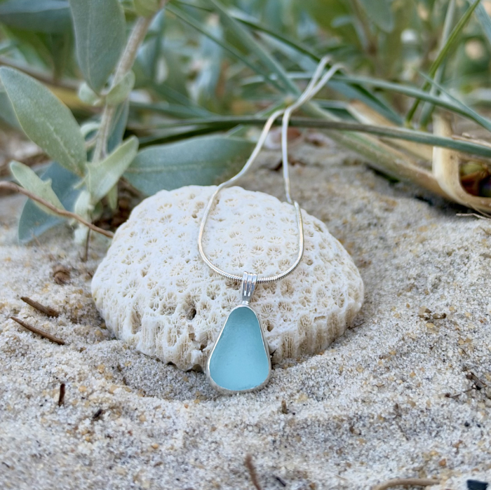 Soft blue sea glass set in silver pendant by Mornington Sea Glass. hangs on a 40 or 45cm 1mm sterling silver snake chain.