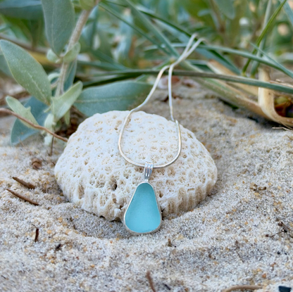 Soft blue sea glass set in silver pendant by Mornington Sea Glass. hangs on a 40 or 45cm 1mm sterling silver snake chain.