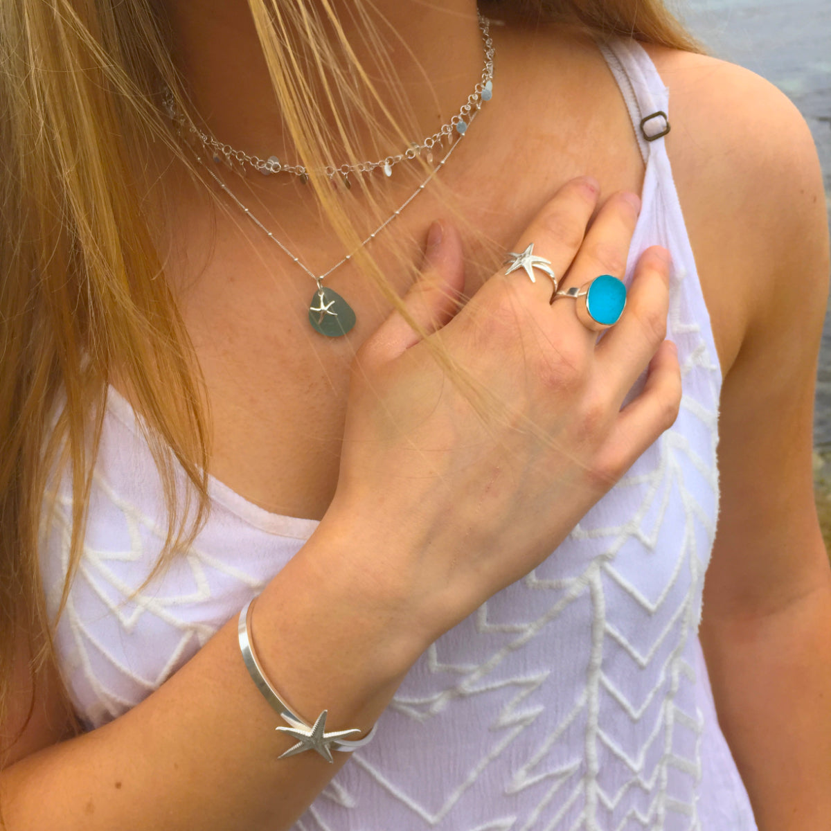 Woman wearing sea glass and sea star jewellery by Mornington Sea Glass