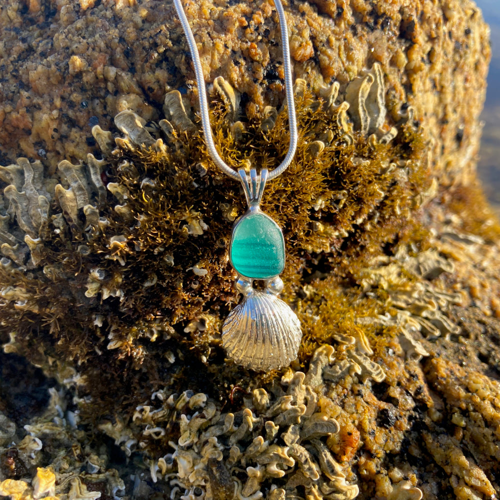  Sterling silver necklace of a cast silver shell with a rare English multi colour green sea glass treasure. Hangs on a 40 or 45cm sterling silver chain. By Mornington Sea Glass.