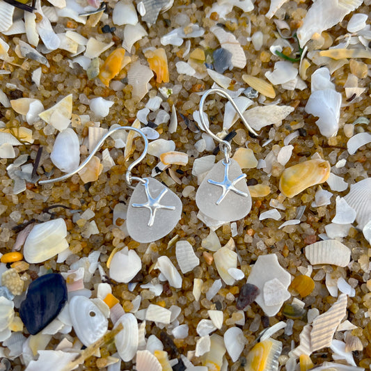 White sea glass and silver sea star earrings  by Mornington Sea Glass.