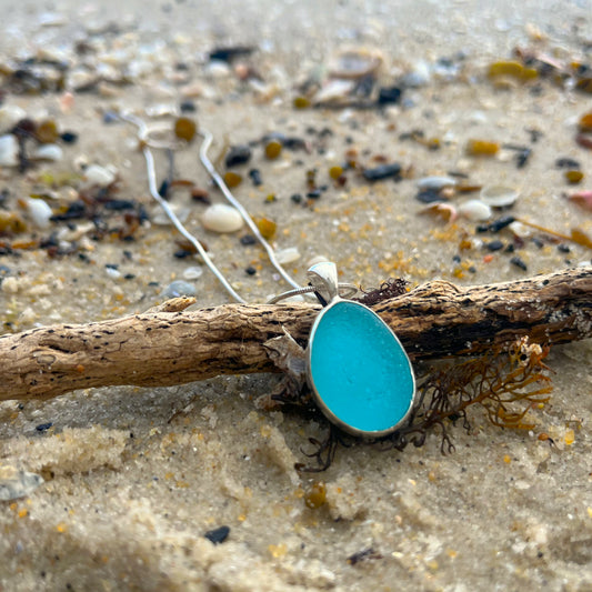 Blue sea glass pendant set in Argentium silver. to the exact shape it washed ashore. Pendant by Mornington Sea Glass.
