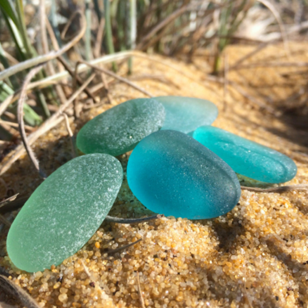 Japanese ocean teal and green sea glass photographed by Mornington Sea Glass at the beach on the Mornington  Peninsula, Victoria, Australia.