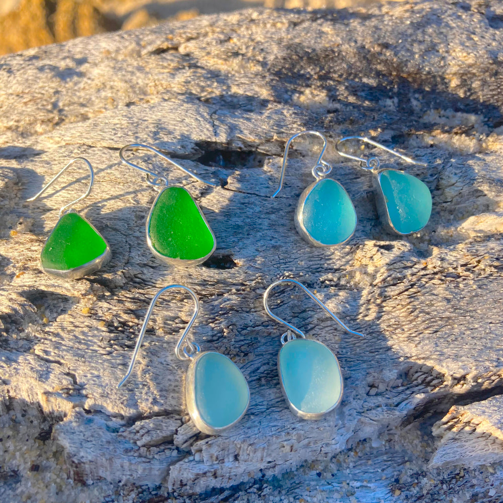 Been and blue sea glass earrings by Mornington Sea Glass photographed at the beach on the Mornington Peninsula, Victoria, Australia