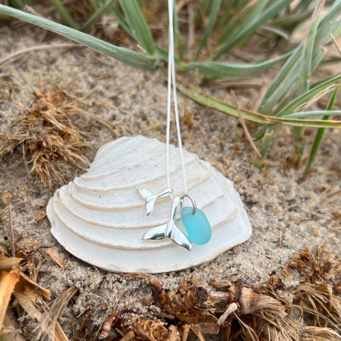 Ocean teal sea glass and two whale tail charms necklace by Mornington Sea Glass. Hangs on a fine box chain 40cm plus 4cm extension.