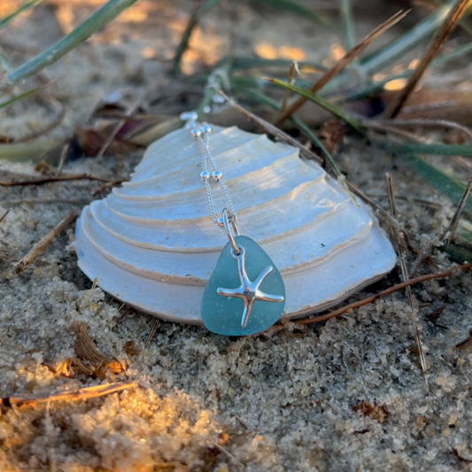 Ocean blue sea glass and sterling silver starfish pendant by Mornington Sea Glass. Hangs on a 40cm + 5cm extension ball detail chain.