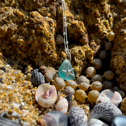 Ocean Blue sea glass and sterling silver starfish pendant by Mornington Sea Glass. Hangs on a 40cm + 5cm extension ball detail chain.